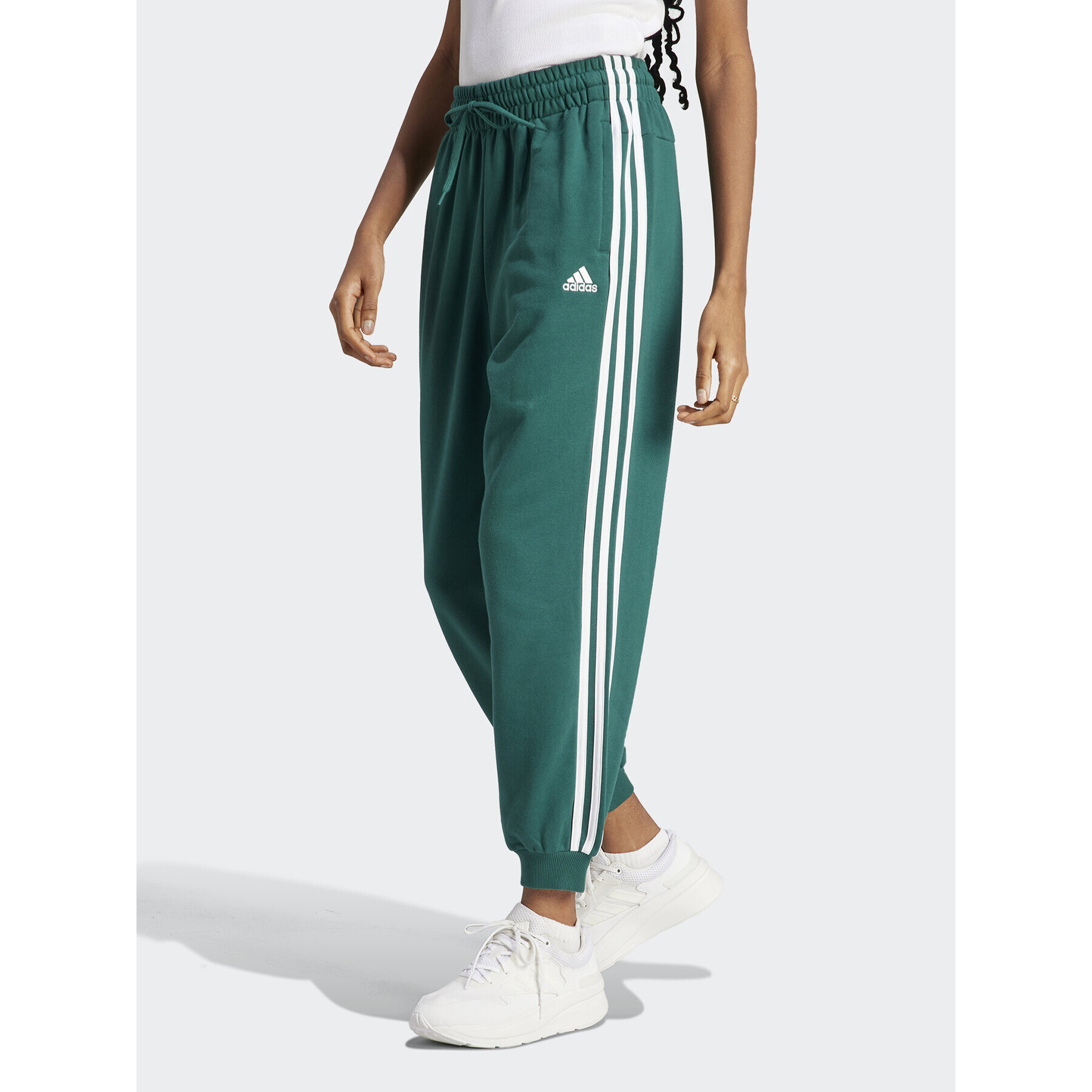 adidas Melegítő alsó Essentials 3-Stripes French Terry Loose-Fit Joggers IL3448 Zöld Loose Fit - Pepit.hu