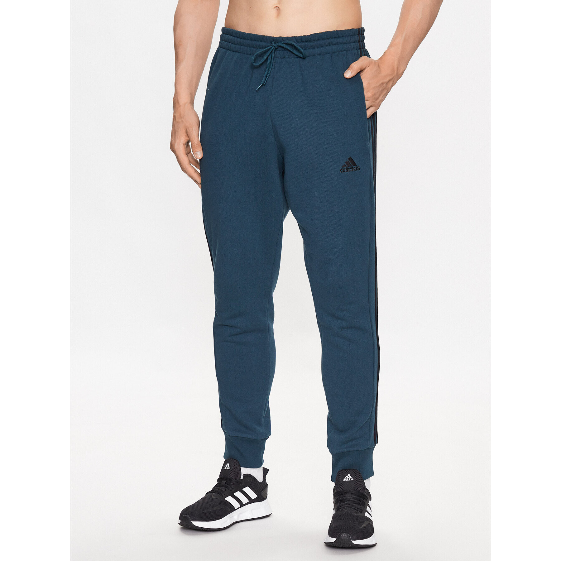 adidas Melegítő alsó Essentials French Terry Tapered Cuff 3-Stripes Joggers IJ8698 Türkizkék Regular Fit - Pepit.hu