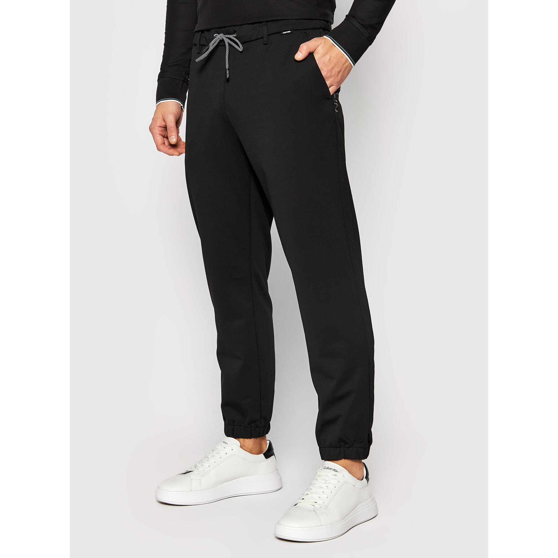 Calvin Klein Melegítő alsó Comfort K10K107498 Fekete Regular Fit - Pepit.hu