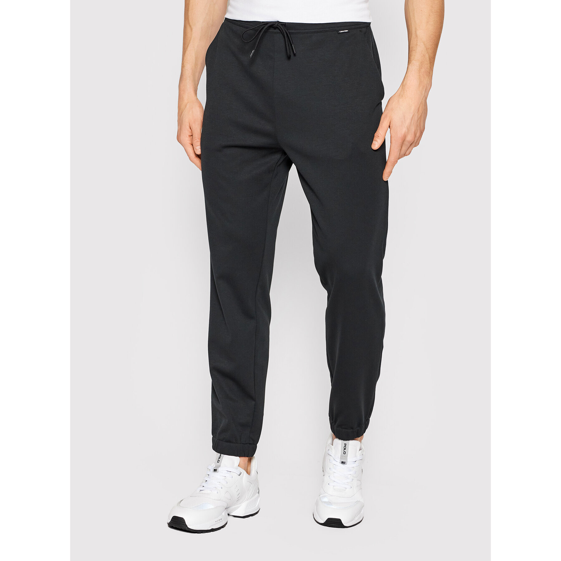 Calvin Klein Melegítő alsó K10K108646 Fekete Slim Fit - Pepit.hu