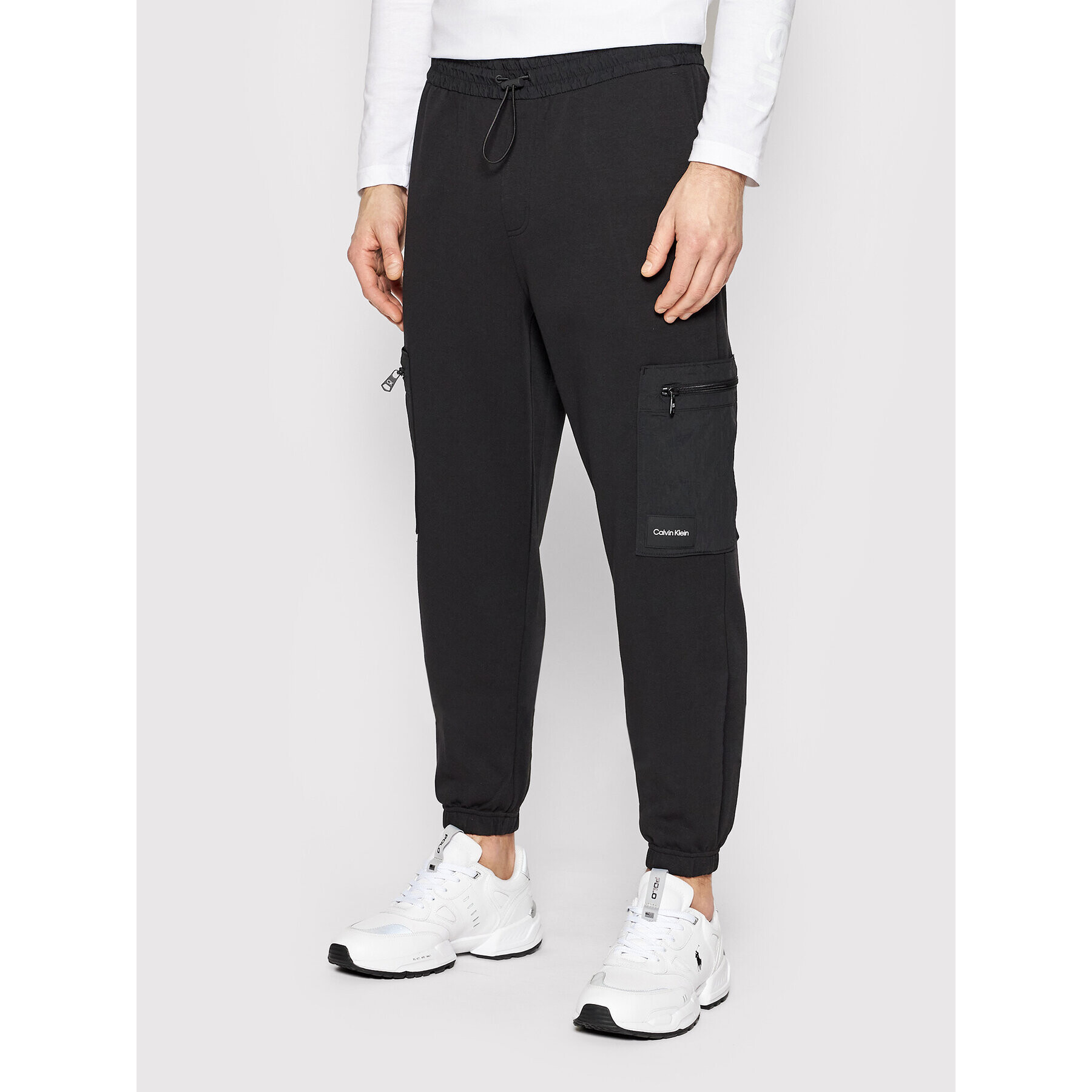 Calvin Klein Melegítő alsó Tech Repreve Comfort K10K108940 Fekete Relaxed Fit - Pepit.hu