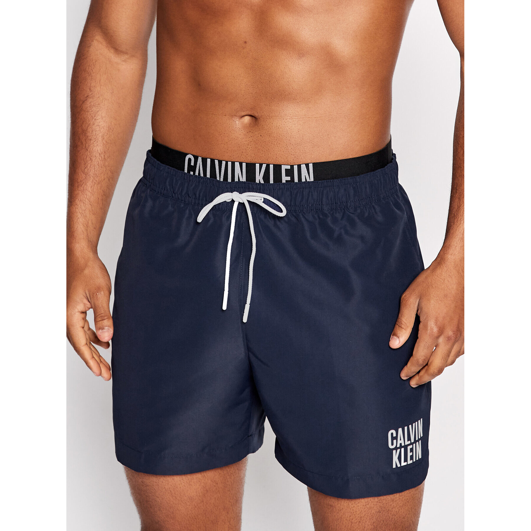 Calvin Klein Swimwear Úszónadrág Intense Power KM0KM00702 Sötétkék Regular Fit - Pepit.hu