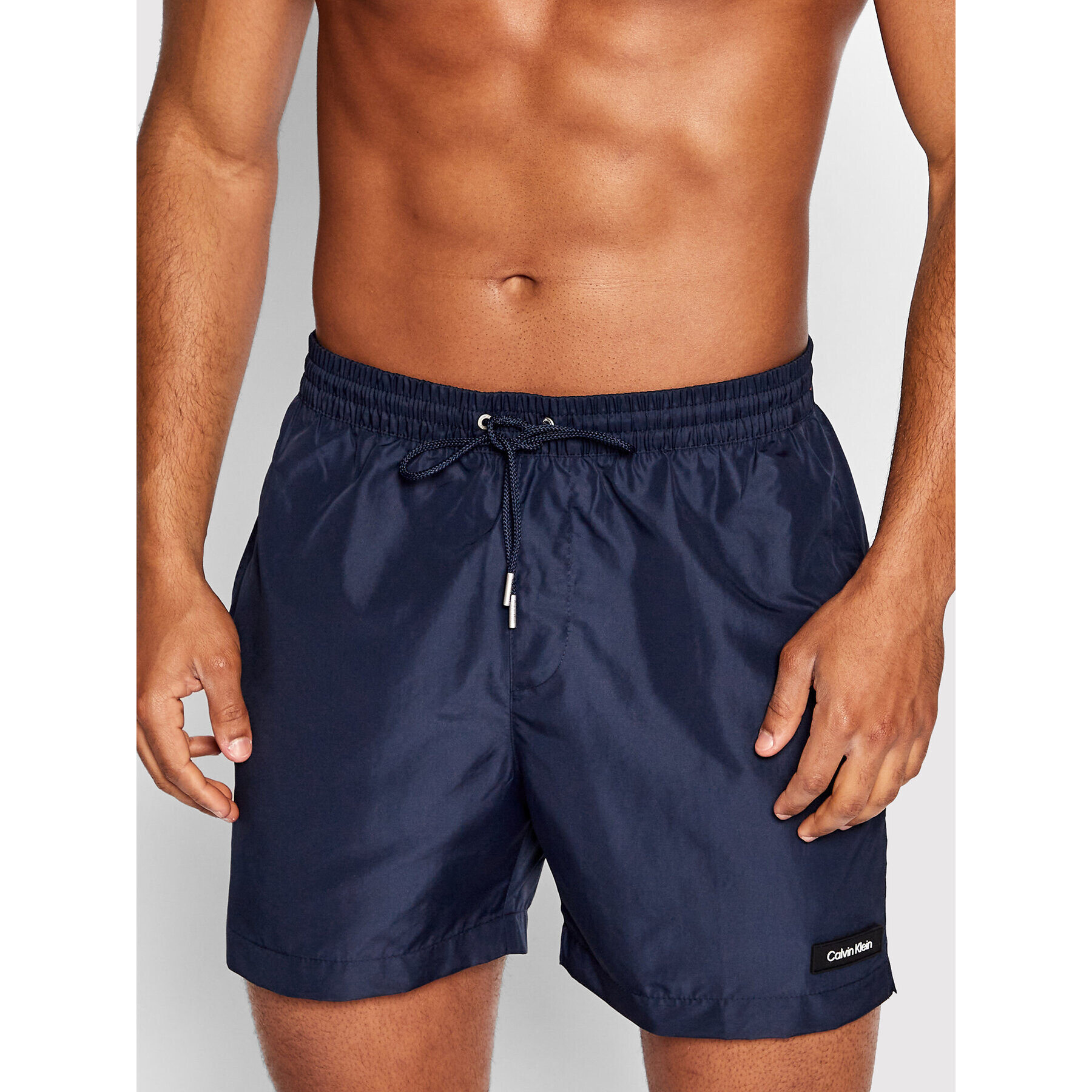 Calvin Klein Swimwear Úszónadrág KM0KM00721 Sötétkék Regular Fit - Pepit.hu