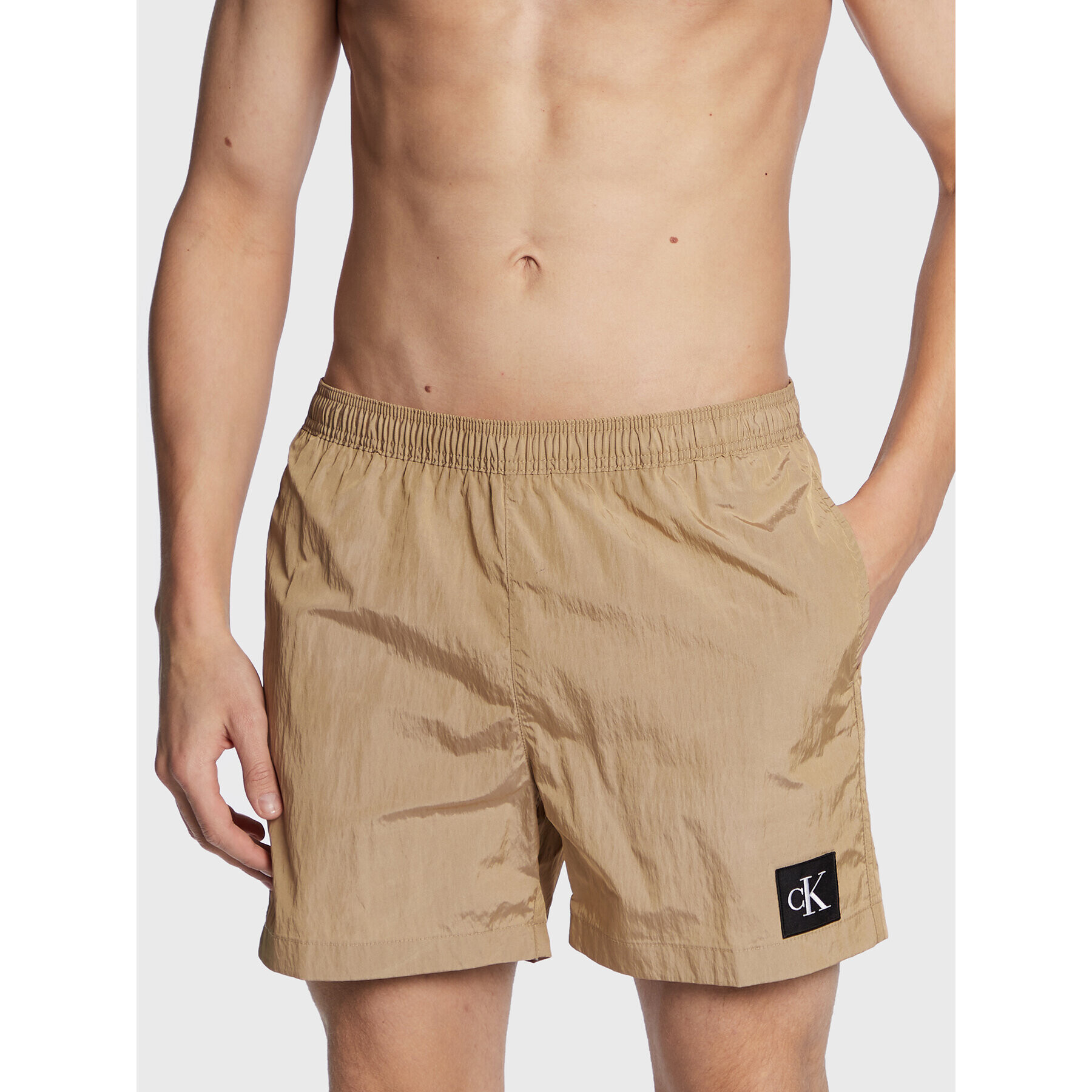 Calvin Klein Swimwear Úszónadrág KM0KM00819 Bézs Regular Fit - Pepit.hu