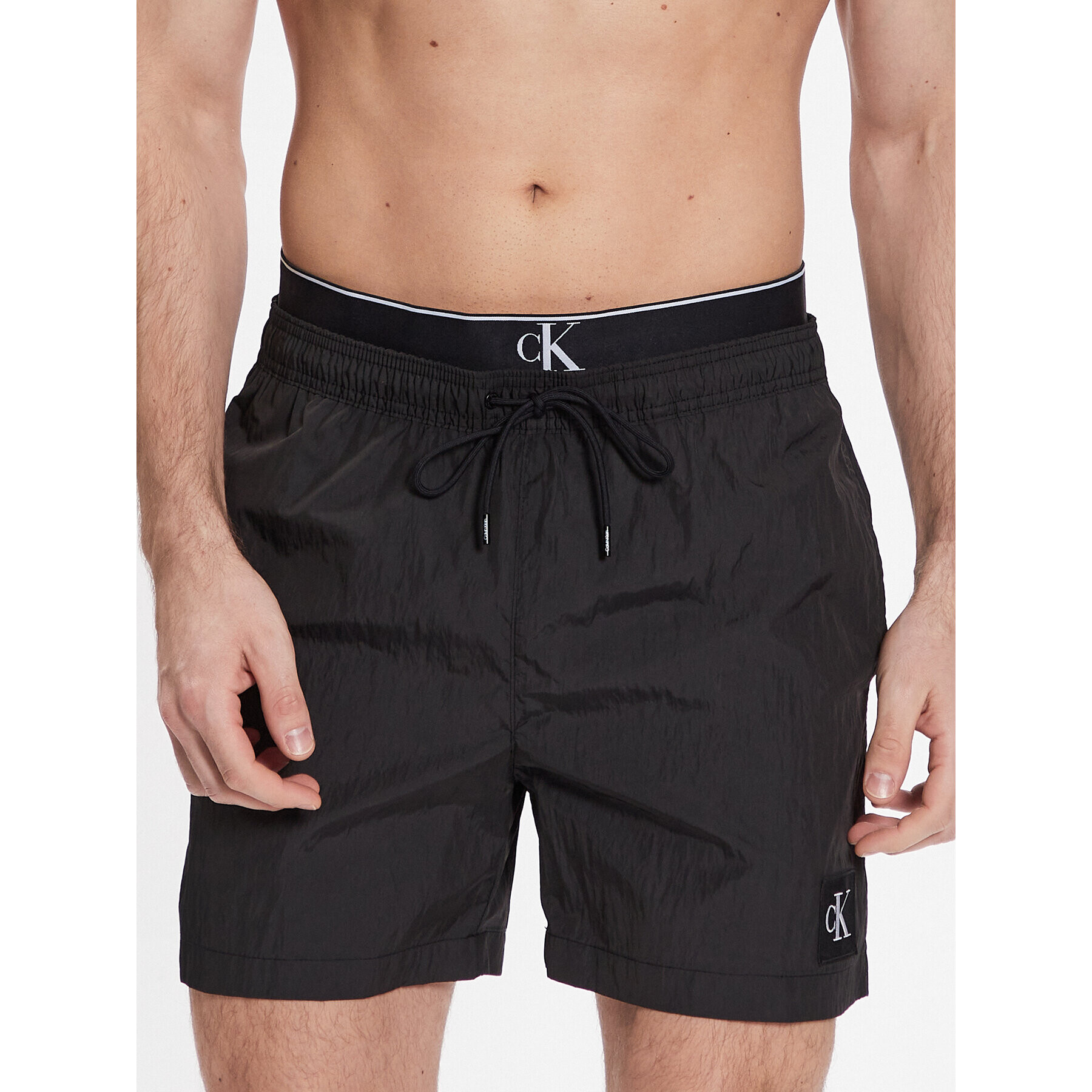 Calvin Klein Swimwear Úszónadrág Medium Double Wb KM0KM00846 Fekete Regular Fit - Pepit.hu