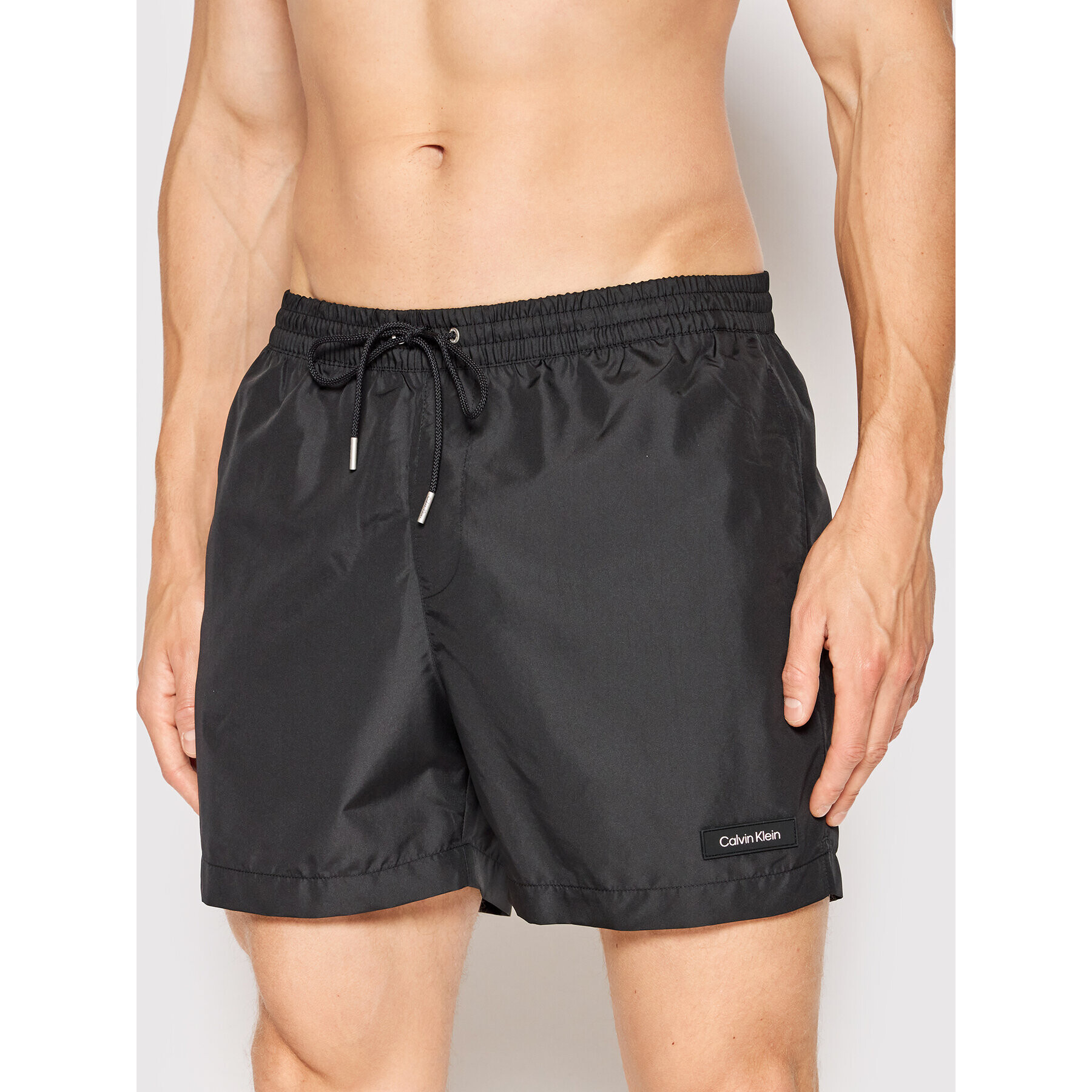 Calvin Klein Swimwear Úszónadrág Medium Drawstring KM0KM00721 Fekete Regular Fit - Pepit.hu