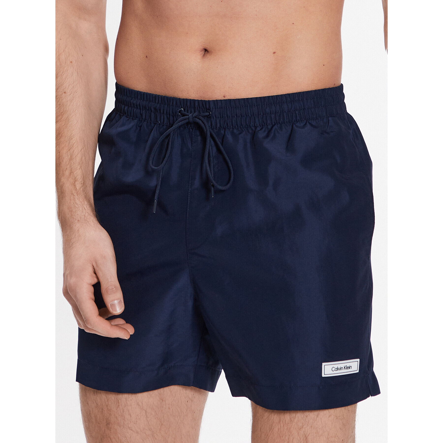 Calvin Klein Swimwear Úszónadrág Medium Drawstring KM0KM00812 Sötétkék Regular Fit - Pepit.hu